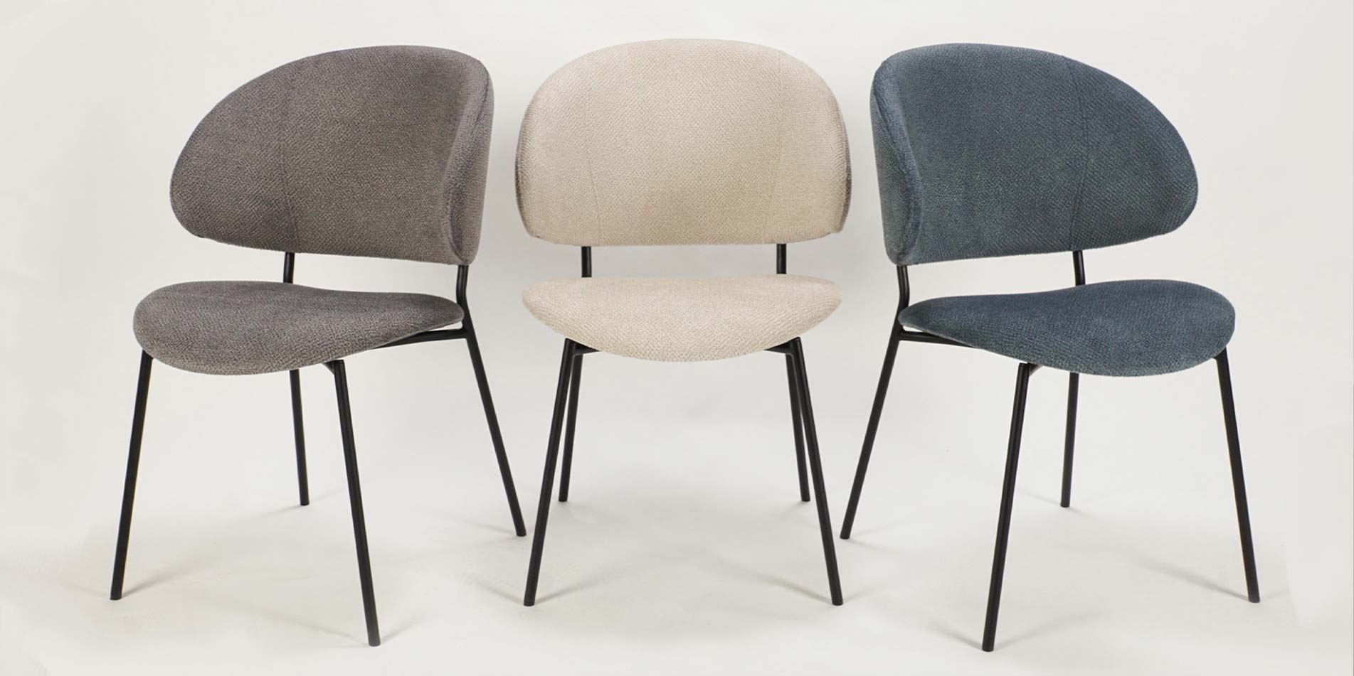 Three dining chair Alexis with black metals legs in beige, grey and denim upholstery. 