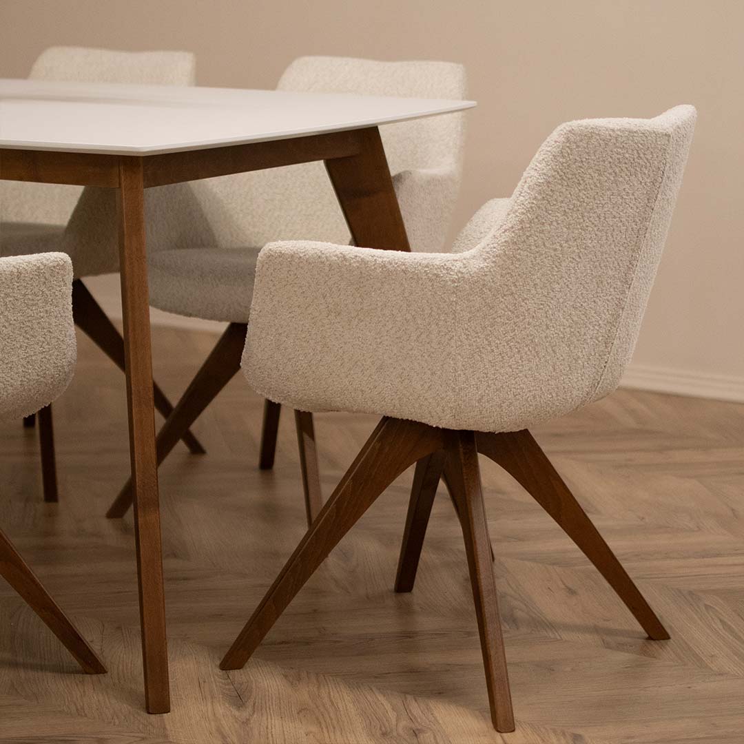 Dining room with chair Kerol with beech wooden legs and cream boucle and table Rigel.