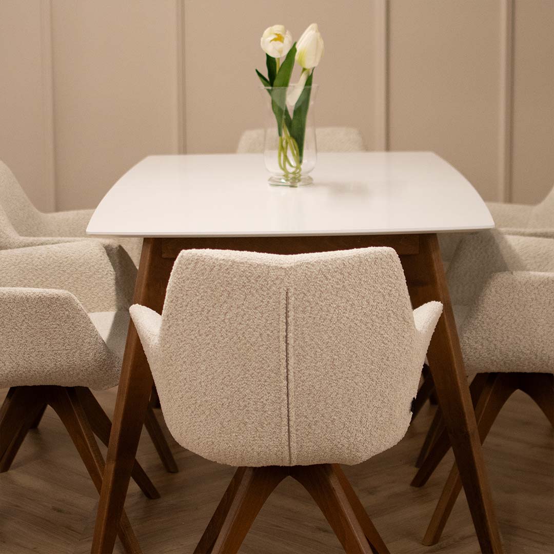 Dining room with chair Kerol with beech wooden legs and cream boucle and table Rigel.