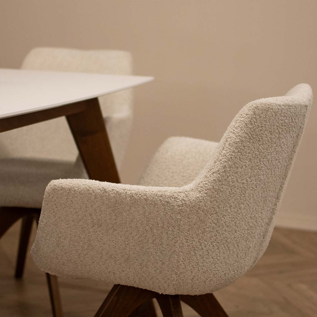 Dining room with chair Kerol with beech wooden legs and cream boucle and table Rigel.