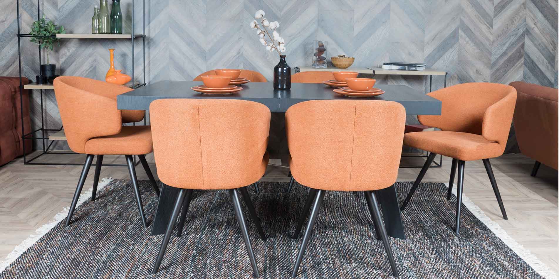 Dining table Vega by Mahagoni Furniture in black oak wood and orange dining chairs