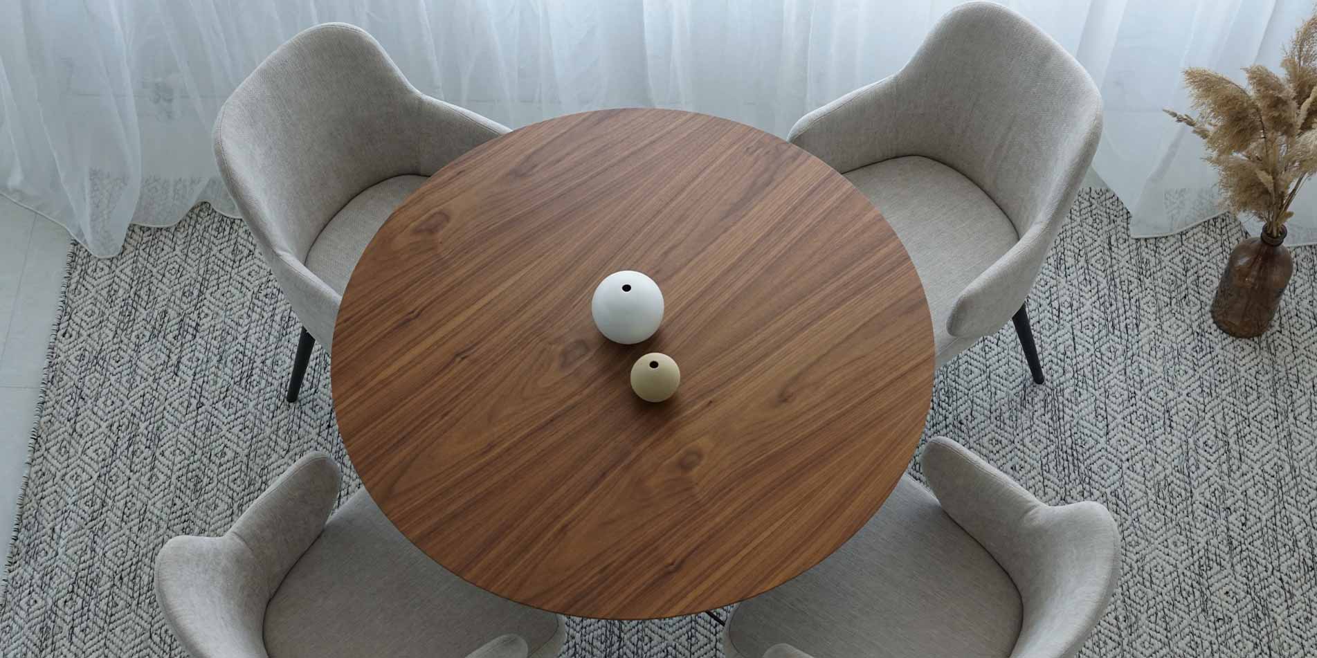 Small round dining table with four dining chairs by Mahagoni Furniture