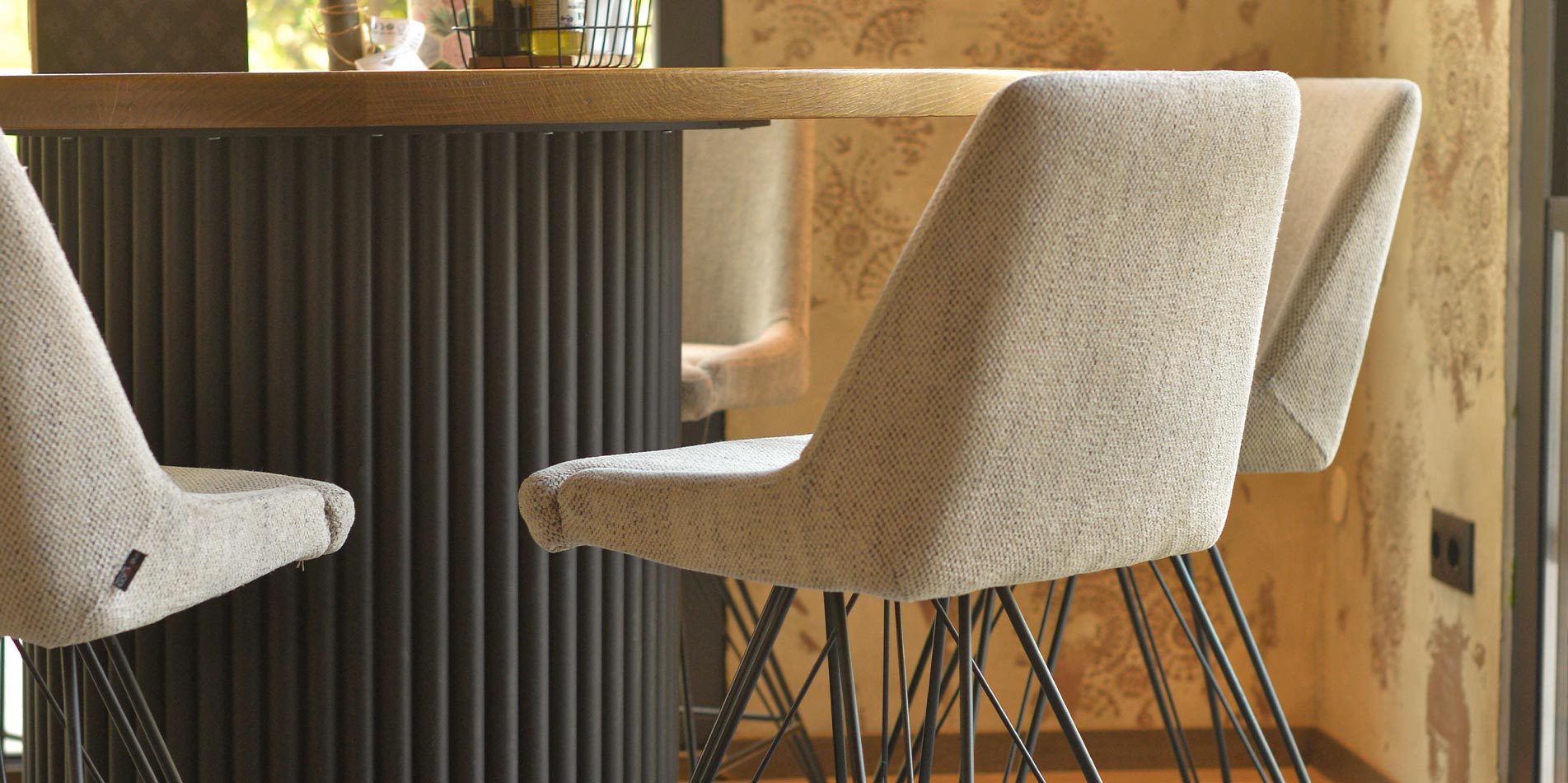 Bar chairs in beige in coffee bar on round table