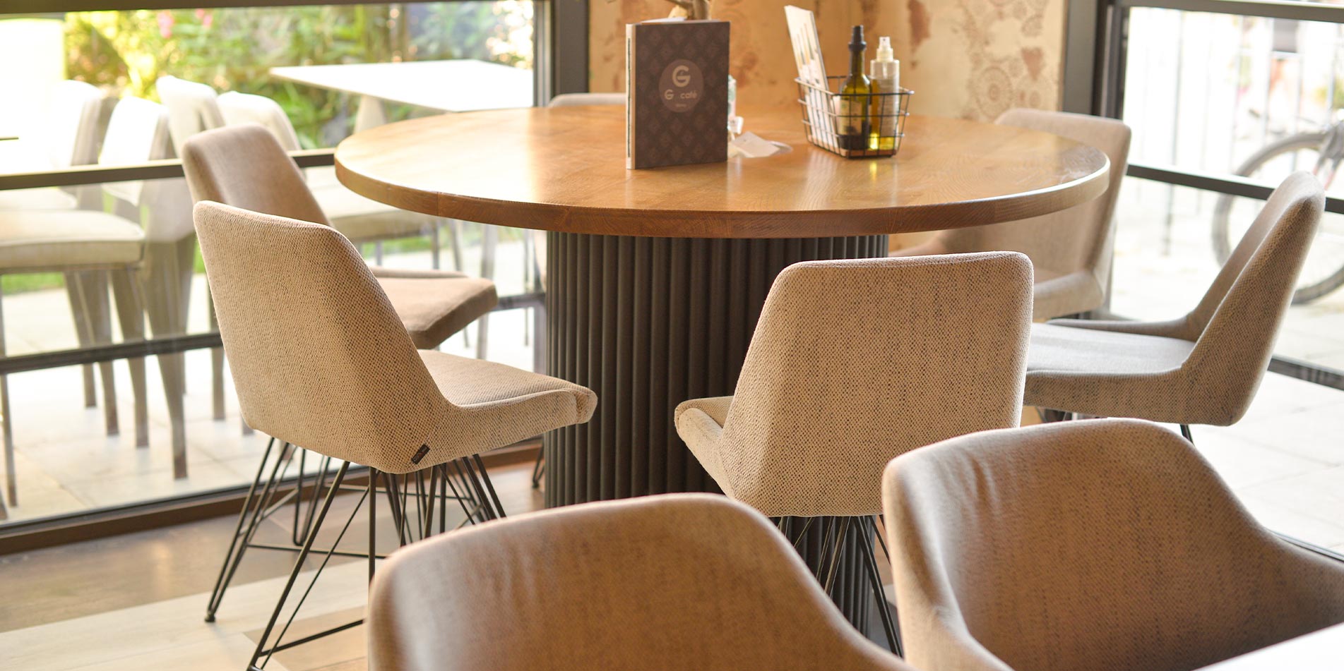 Bar chairs in coffee bar on round table