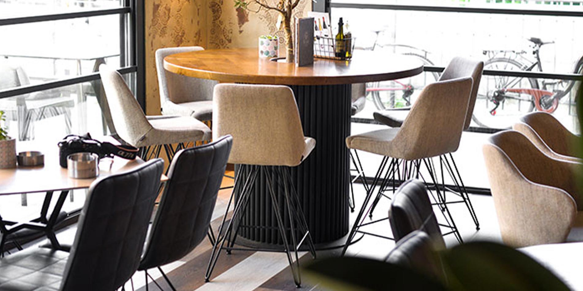 Bar chairs in coffee bar on round table