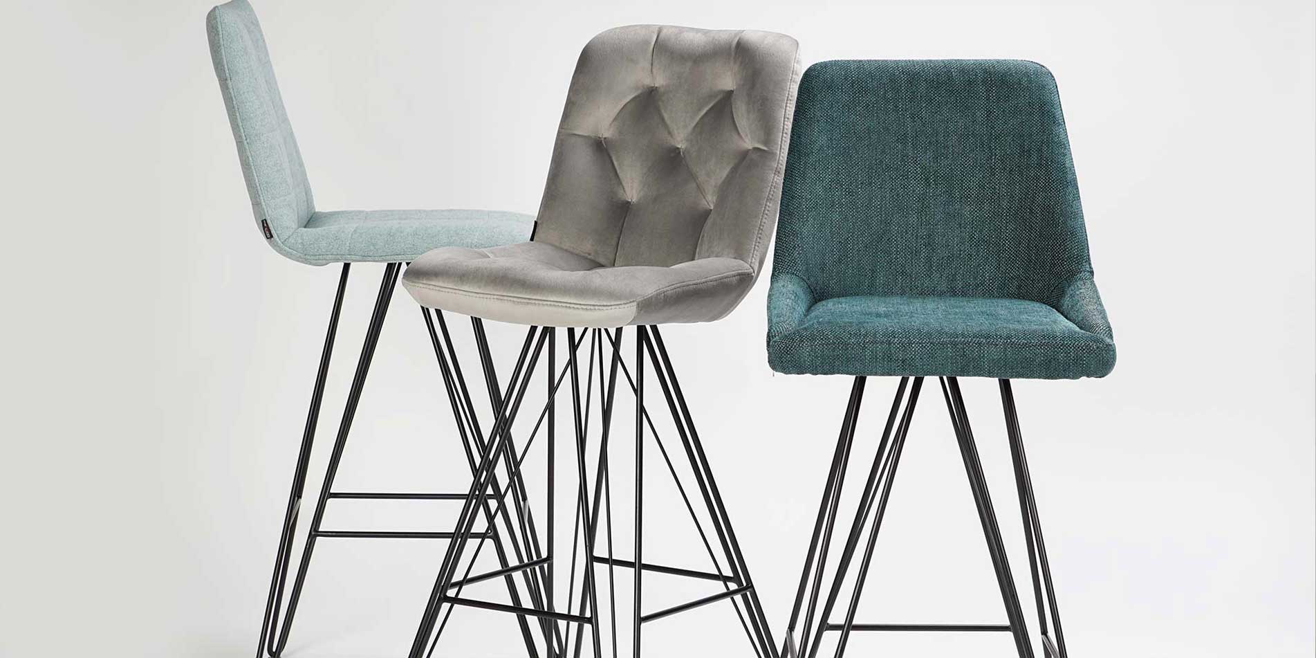 Bar chairs with black metal legs and mint upholstery