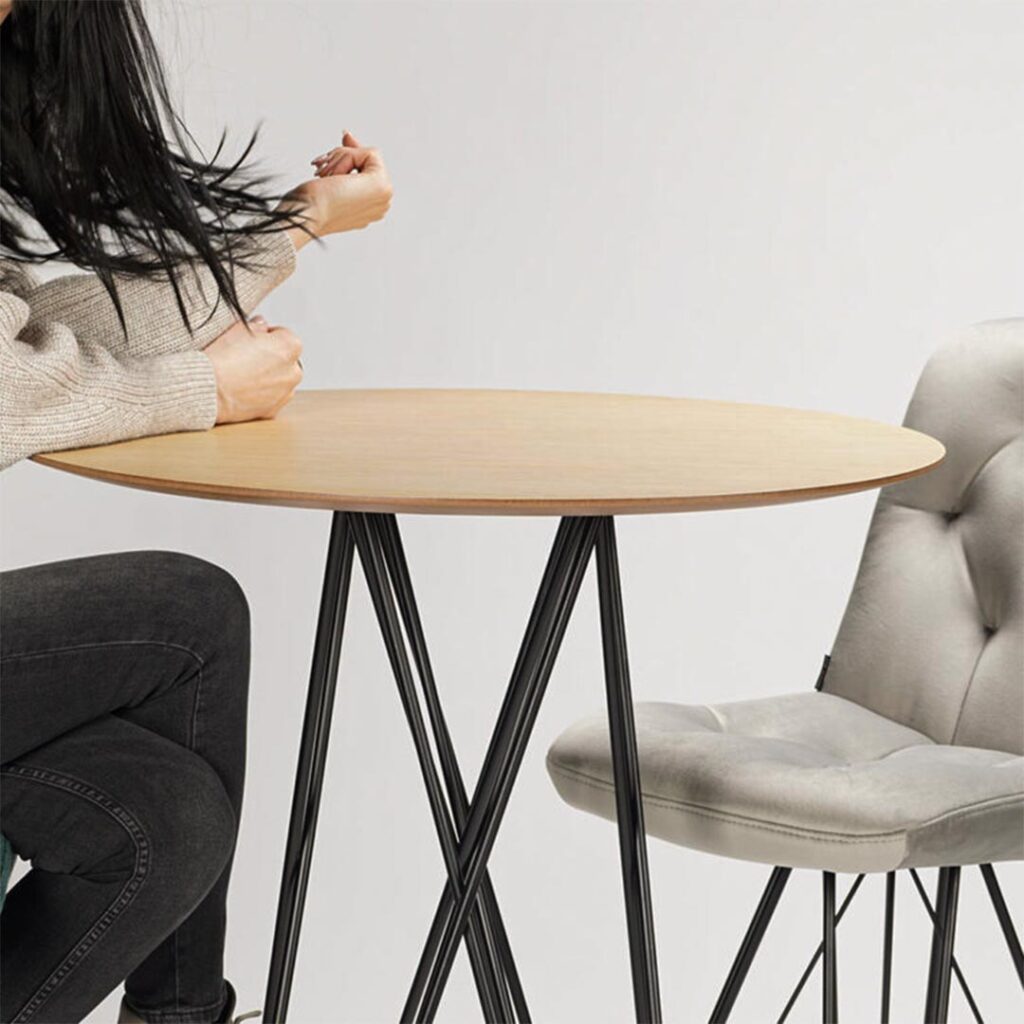 Round bar table with oak table top and with woman