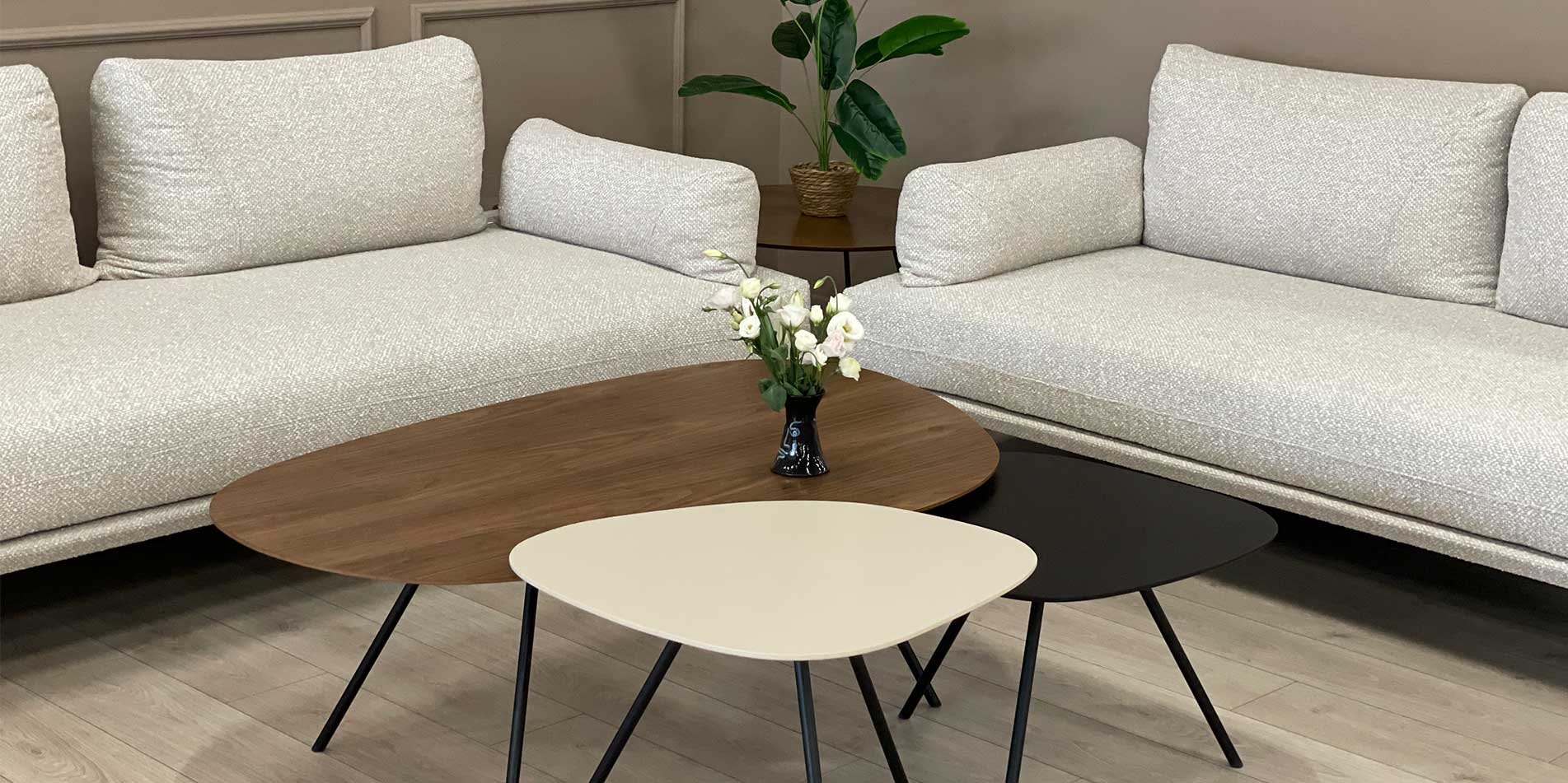 Three coffee tables in different highs and materials