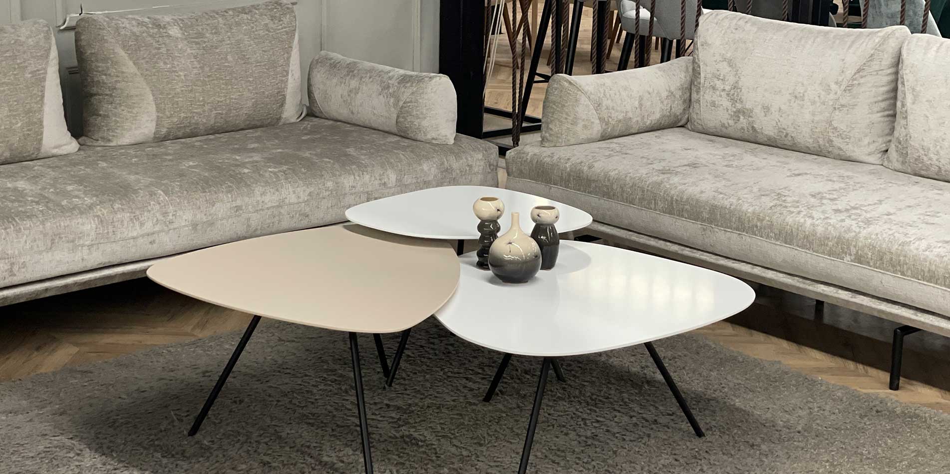 Three coffee tables in different highs and materials