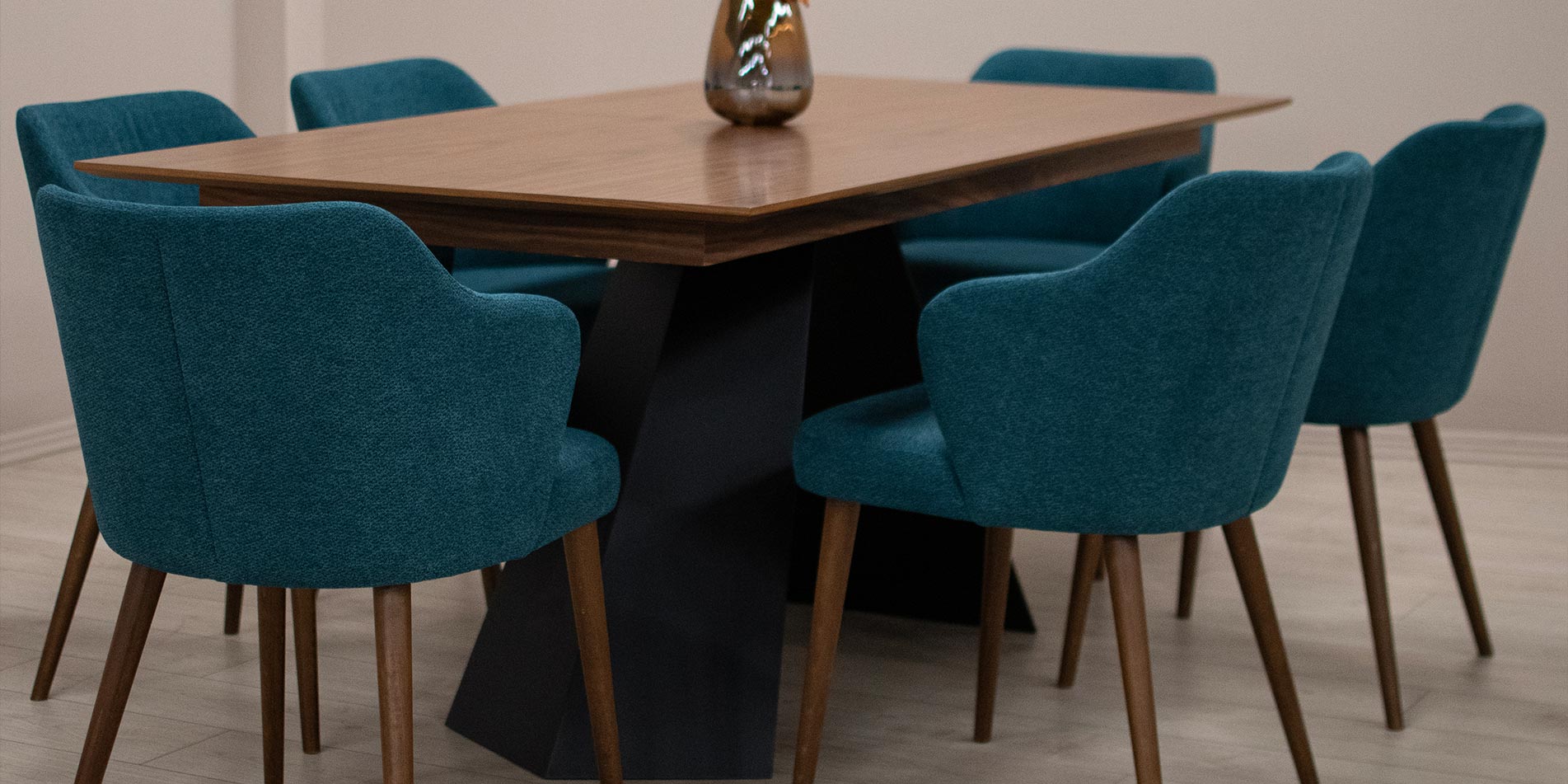 Armchair in blue upholstery and beech wood legs.