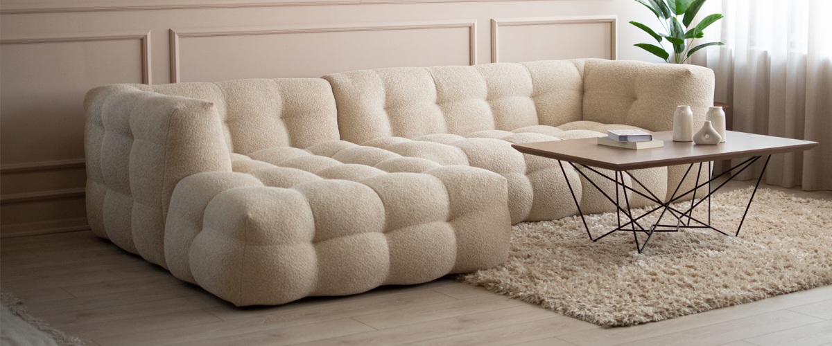 Modular sofa in beige boucle.