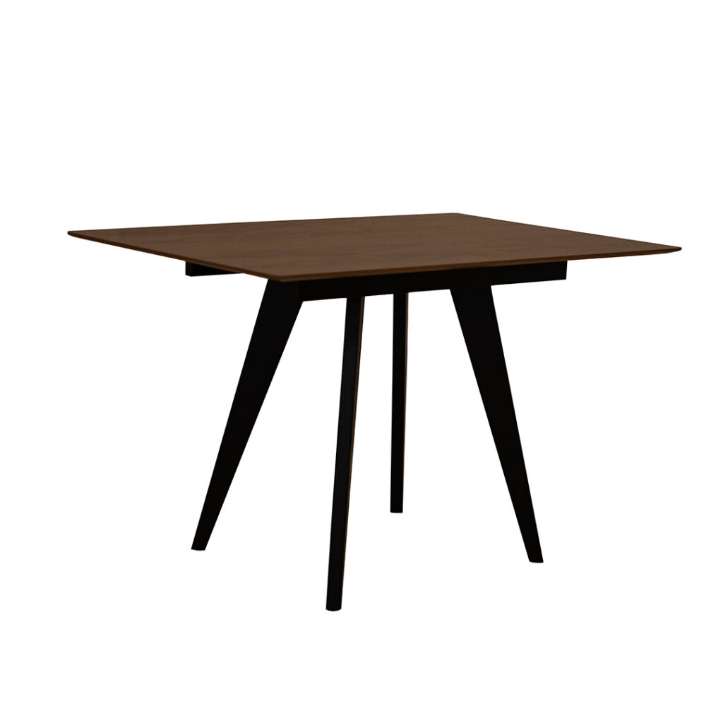 Extendable dining table with walnut top and black wooden legs.