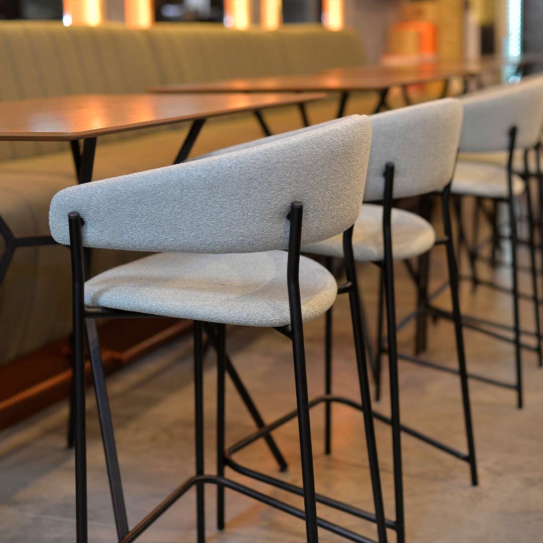 Bar chair Amelie in mint upholstery in lounge bar, combinate with wood walnut.