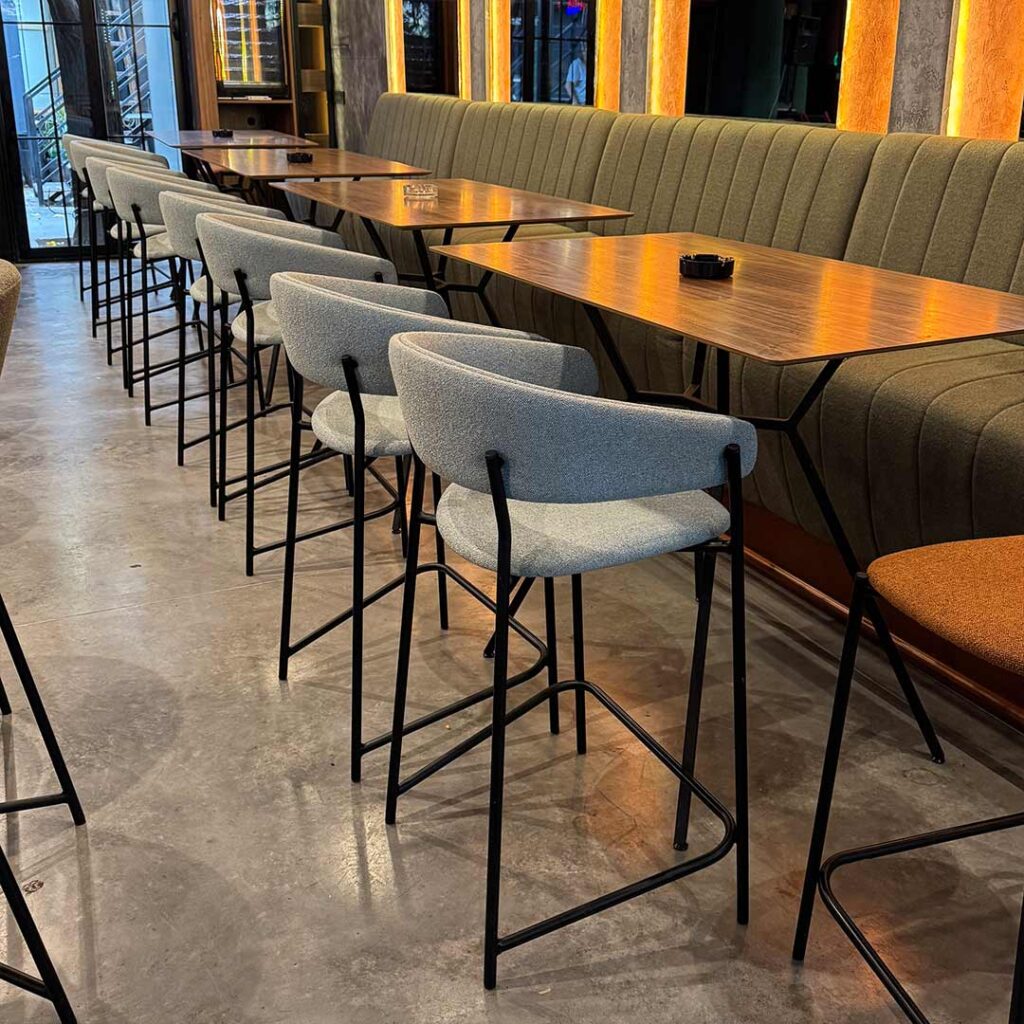 Bar chair Amelie in mint upholstery in lounge bar, combinate with wood walnut.