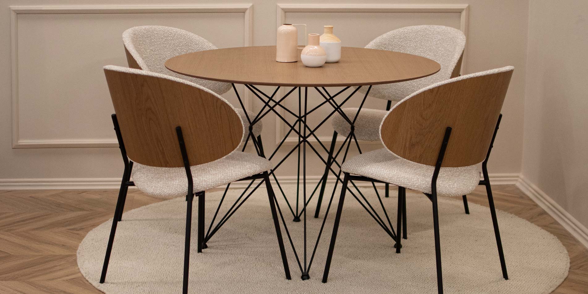 Dining chair with veneer back of oak, on round table with metal legs. 