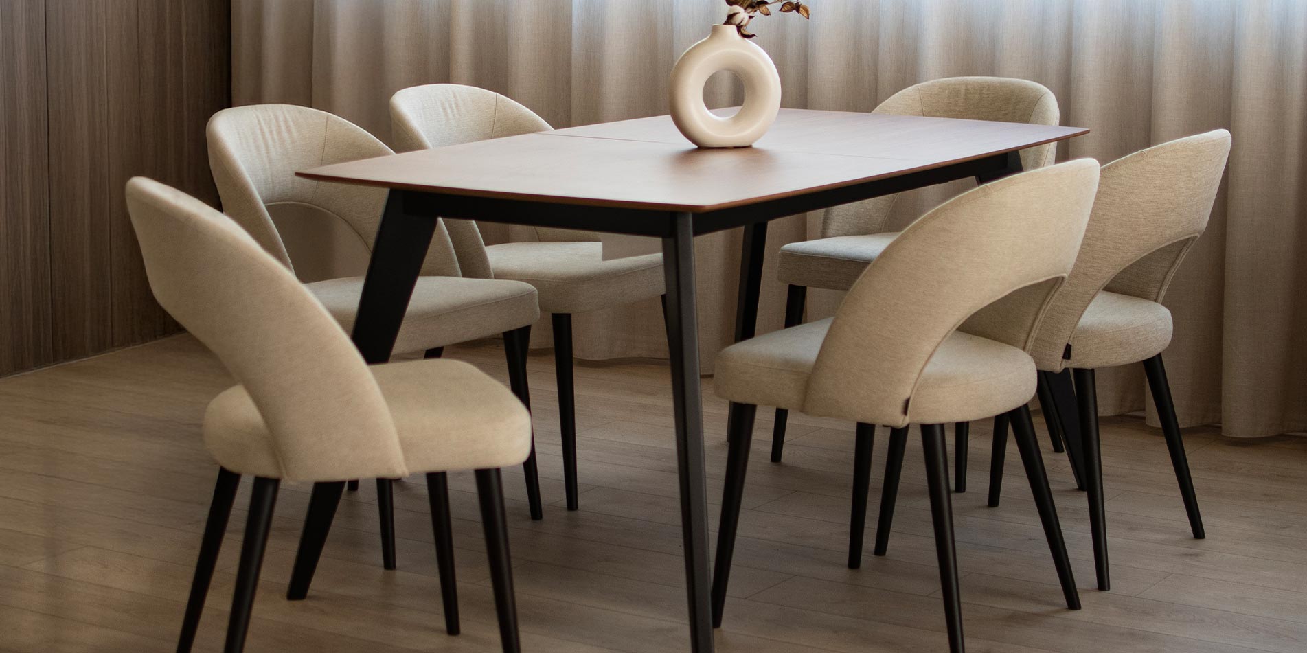 Dining table Rigel with walnut table top and black wooden legs.