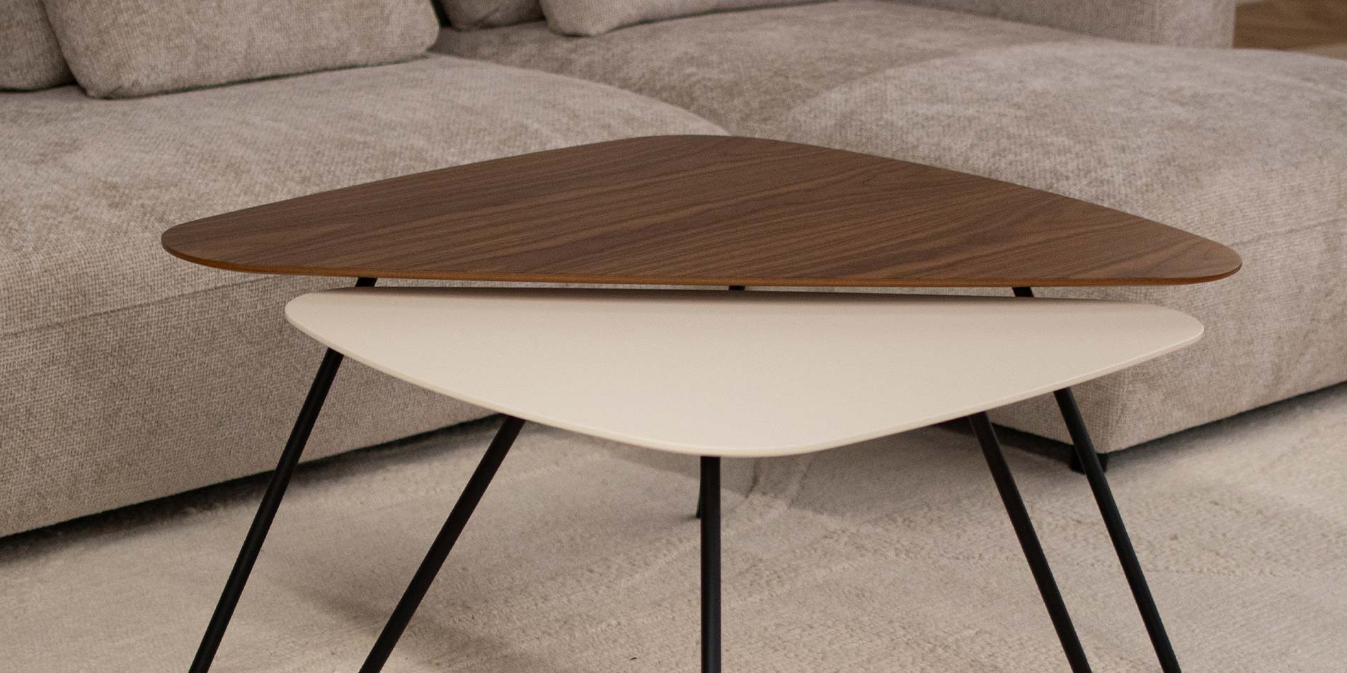 Coffee table with three angle form, in combination of walnut and beige MDF.