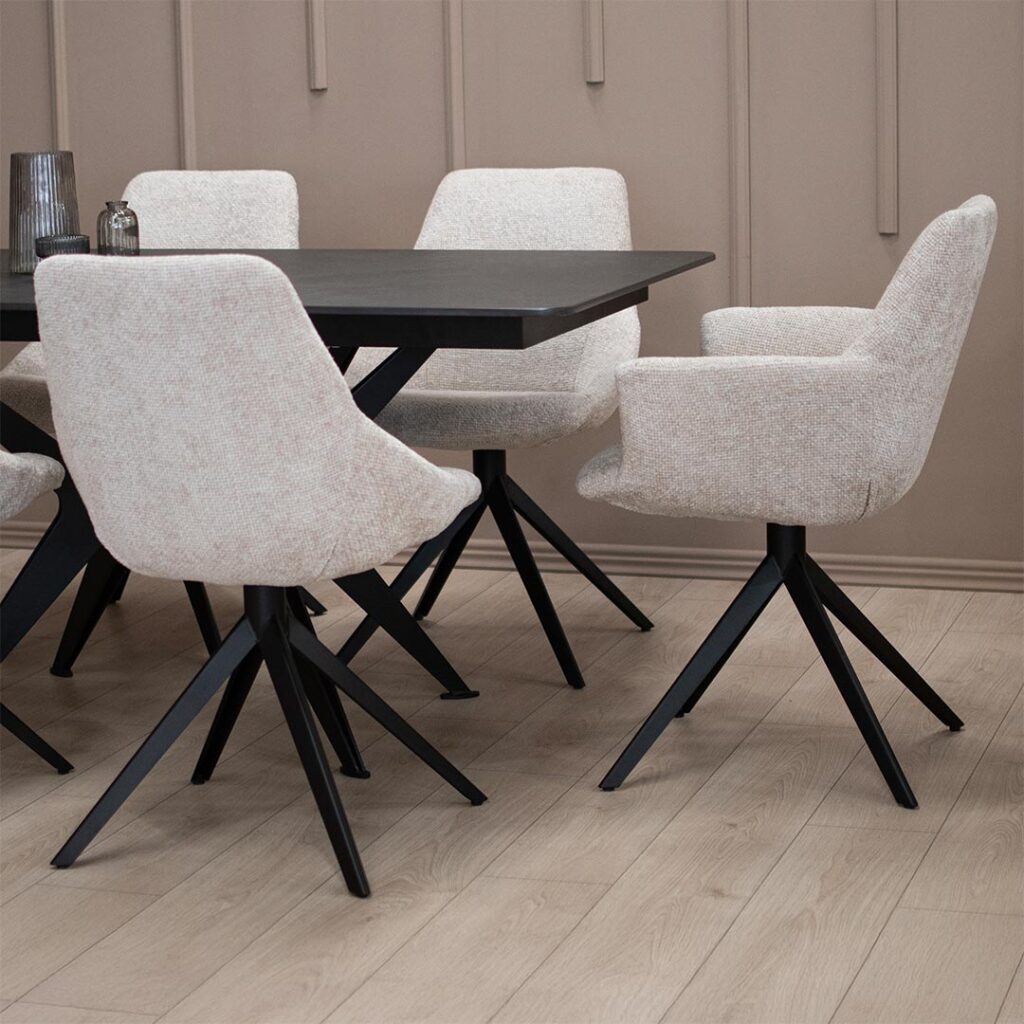 Трпезариски сет со маса со црна керамичка плотна и метални ногарки во форма X во комбинацоја со столици со и без раконаслон со метални ногарки.