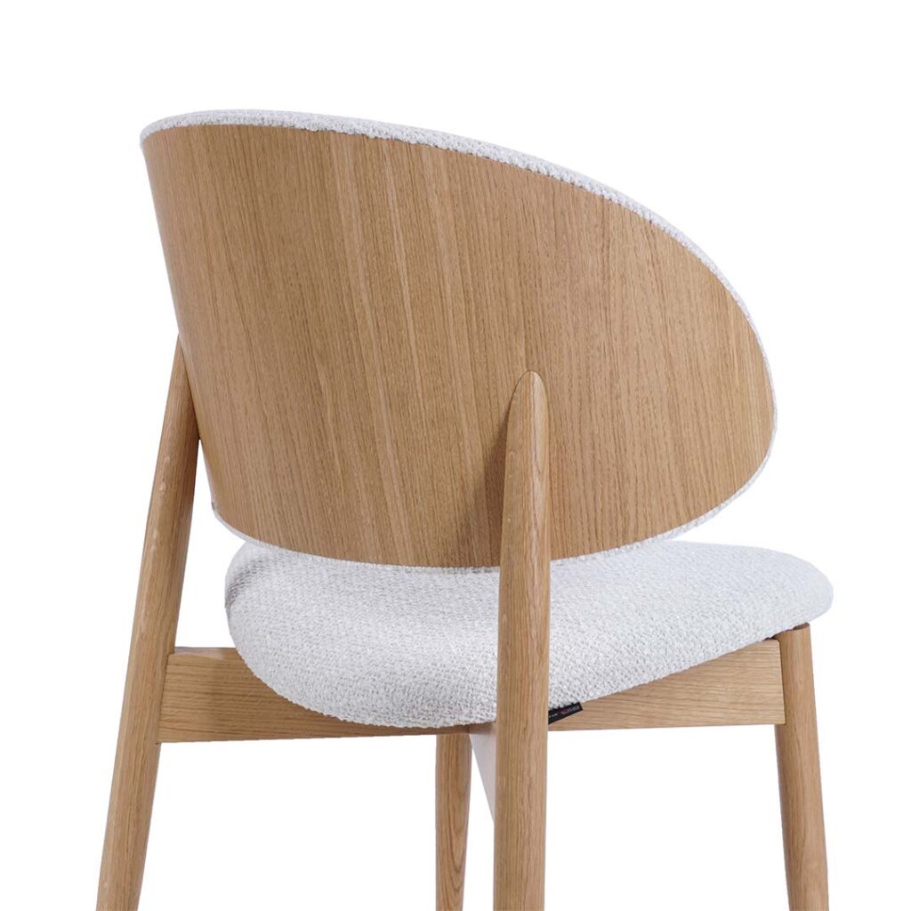 Dining chair Celine with wooden oak legs and back from oak veneer combine with white upholstery.