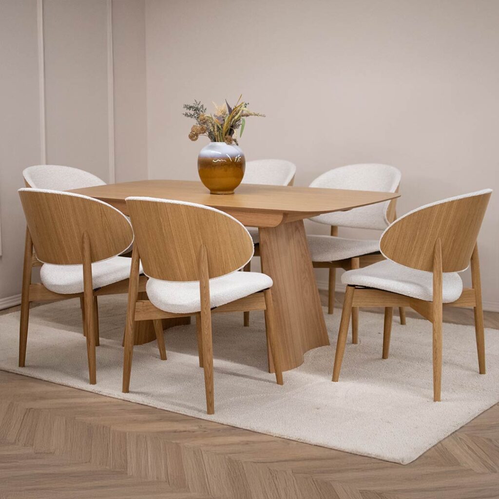 Dining chairs with wooden legs and back from veneer of oak and white upholstery.